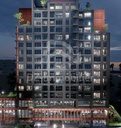 Étages et socle d’un bloc de TOR Finance City de nuit (image de synthèse)