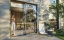 Rendu 3D : cuisine-salle à manger ouverte sur un patio